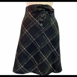 Dalia plaid skirt button and ribbon tie detail